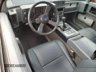 1987 Pontiac Fiero GT z VIN 1G2PG1199HP214795, wystawiony jako Copart lot #75901054 z przebiegiem 206 675 mil mil oraz Szkody całkowita. Historia ofert i sprzedaży dostępna na DreamBid. Obrazek 8.