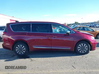 2023 Chrysler Pacifica Hybrid Limited with VIN 2C4RC1S7XPR518695, listed as a IAAI auction lot 41301401 with 24,433 mi miles and . Bid and sale history available at DreamBid. Image 13.