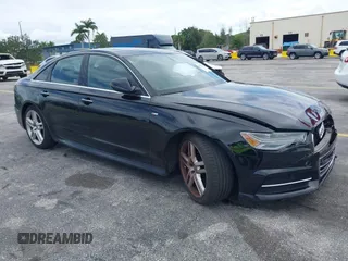 2016 Audi A6 2.0T Premium Plus with VIN WAUGFAFC6GN055826, listed as a IAAI auction lot 42011778 with 98,210 mi miles. Bid and sale history available at carsss.com. Image 1.