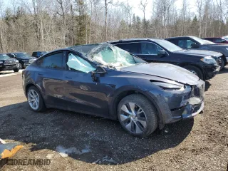 2023 Tesla Model Y Long Range with VIN LRWYGDEE4PC137054, listed as a Copart auction lot 48340895 with 0 mi miles and Non Repairable. Bid and sale history available at carsss.com. Image 4.