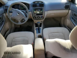 2006 Kia Spectra EX with VIN KNAFE122X65278395, listed as a Copart auction lot 51773205 with 243,978 mi miles and Salvage Title. Bid and sale history available at carsss.com. Image 8.