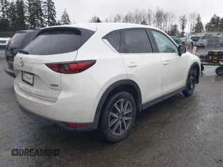 2017 Mazda CX-5 Grand Touring with VIN JM3KFBDL5H0148574, listed as a IAAI auction lot 41867827 with 32,382 mi miles. Bid and sale history available at carsss.com. Image 4.