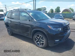 2023 Honda Passport Elite with VIN 5FNYF8H01PB030270, listed as a IAAI auction lot 42667744 with 7,931 mi miles and . Bid and sale history available at DreamBid. Image 1.
