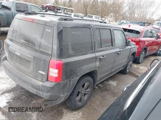 2015 Jeep Patriot High Altitude with VIN 1C4NJRFB0FD272338, listed as a IAAI auction lot 41448363 with 131,170 mi miles and . Bid and sale history available at carsss.com. Image 4.