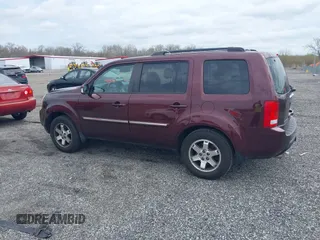 2010 Honda Pilot Touring with VIN 5FNYF4H95AB040721, listed as a IAAI auction lot 41928412 with 213,219 mi miles and . Bid and sale history available at carsss.com. Image 14.