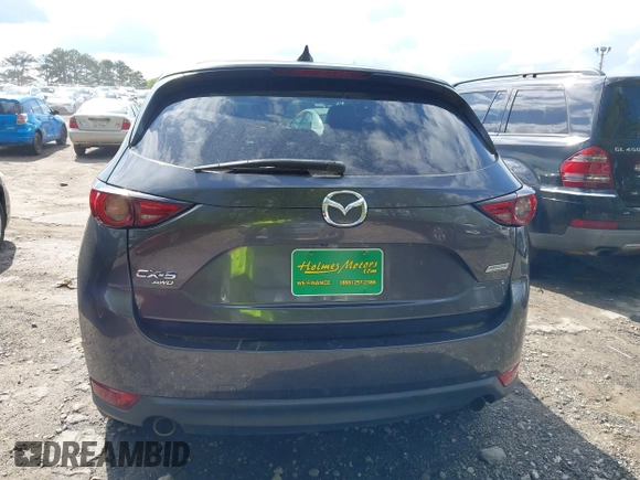 2019 Mazda CX-5 Grand Touring with VIN JM3KFBDM7K0619379, listed as a IAAI auction lot 42007107 with 209,590 mi miles. Bid and sale history available at carsss.com. Image 16.