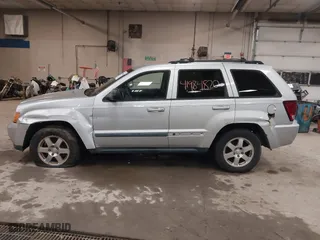 2009 Jeep Grand Cherokee Laredo with VIN 1J8GR48K89C553694, listed as a IAAI auction lot 41984820 with 196,266 mi miles. Bid and sale history available at carsss.com. Image 12.