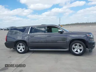 2015 Chevrolet Suburban LTZ with VIN 1GNSCKKC9FR500933, listed as a IAAI auction lot 41830980 with 169,217 mi miles and . Bid and sale history available at DreamBid. Image 12.