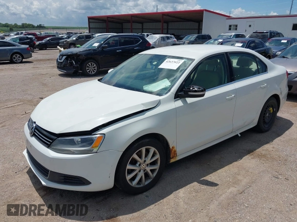 2014 Volkswagen Jetta SE with VIN 3VWD07AJXEM333132, listed as a IAAI auction lot 42637022 with 157,113 mi miles and . Bid and sale history available at DreamBid. Image 2.