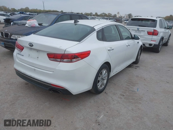 2016 Kia Optima LX with VIN KNAGT4L39G5104726, listed as a IAAI auction lot 40950914 with 128,728 mi miles. Bid and sale history available at carsss.com. Image 4.