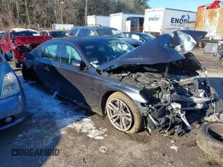 2016 BMW 7 Series 750i xDrive with VIN WBA7F2C51GG419652, listed as a IAAI auction lot 41197582 with 141,895 mi miles. Bid and sale history available at carsss.com. Image 1.