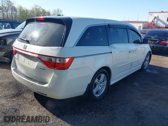 2012 Honda Odyssey Touring with VIN 5FNRL5H93CB146753, listed as a IAAI auction lot 41984850 with 155,309 mi miles and . Bid and sale history available at DreamBid. Image 4.