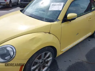 2012 Volkswagen Beetle 2.5L w/Sound/Nav PZEV with VIN 3VWJP7AT4CM613867, listed as a IAAI auction lot 41602806 with 167,004 mi miles. Bid and sale history available at carsss.com. Image 6.