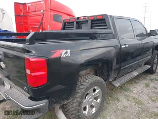 2014 Chevrolet Silverado 1500 LTZ with VIN 3GCUKSECXEG229900, listed as a IAAI auction lot 41962785 with 156,984 mi miles. Bid and sale history available at carsss.com. Image 4.