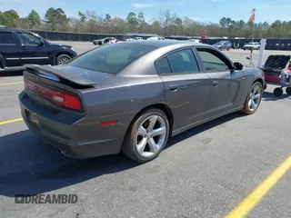 2014 Dodge Charger SE with VIN 2C3CDXBG0EH216023, listed as a IAAI auction lot 41827307 with 243,107 mi miles. Bid and sale history available at carsss.com. Image 4.