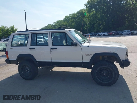 1996 Jeep Cherokee Sport z VIN 1J4FJ68S3TL226188, wystawiony jako IAAI lot #42460538 z przebiegiem 217 118 mil mil oraz . Historia ofert i sprzedaży dostępna na DreamBid. Obrazek 13.