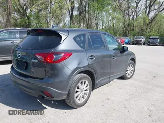 2016 Mazda CX-5 Touring z VIN JM3KE2CY4G0708972, wystawiony jako IAAI lot #42043013 z przebiegiem 157 573 mil mil oraz . Historia ofert i sprzedaży dostępna na DreamBid. Obrazek 4.