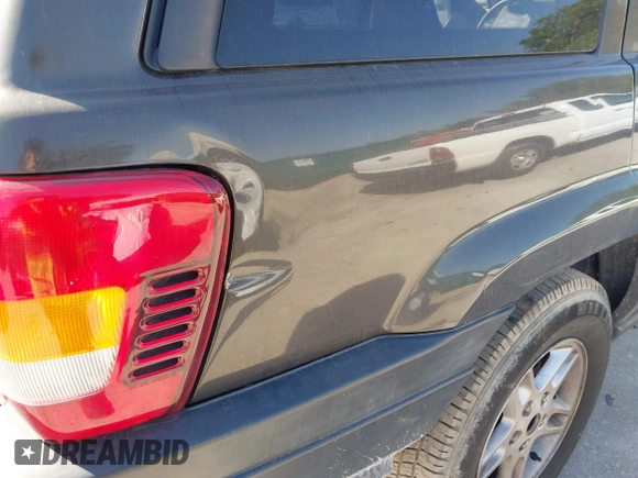 2004 Jeep Grand Cherokee Laredo with VIN 1J4GW48S74C401022, listed as a IAAI auction lot 41982319 with 170,607 mi miles. Bid and sale history available at carsss.com. Image 6.