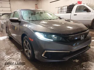 2020 Honda Civic LX z VIN 19XFC2F65LE030888, wystawiony jako IAAI lot #41609630 z przebiegiem 115 614 mil mil oraz . Historia ofert i sprzedaży dostępna na DreamBid. Obrazek 1.