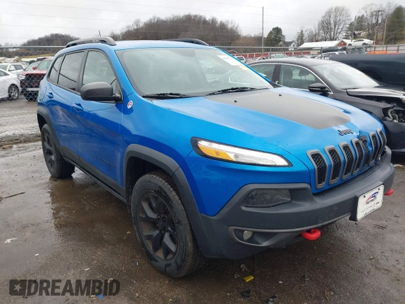 2018 Jeep Cherokee Trailhawk with VIN 1C4PJMBX3JD512813, listed as a IAAI auction lot 41457312 with 125,644 mi miles. Bid and sale history available at carsss.com. Image 1.