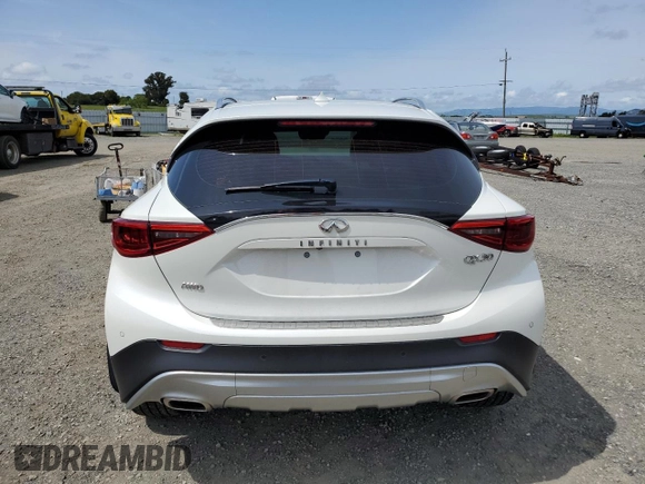 2019 Infiniti QX30 Luxe with VIN SJKCH5CR7KA011861, listed as a Copart auction lot 52147015 with 77,905 mi miles and Salvage title. Bid and sale history available at DreamBid. Image 6.
