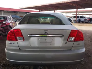 2003 Honda Civic LX with VIN 2HGES16673H537693, listed as a IAAI auction lot 41696832 with 173,842 mi miles. Bid and sale history available at carsss.com. Image 16.