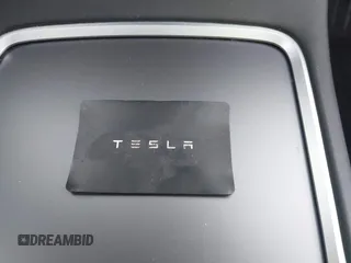 2021 Tesla Model Y Long Range with VIN 5YJYGDEE7MF198867, listed as a IAAI auction lot 42117463 with 79,759 mi miles and . Bid and sale history available at DreamBid. Image 11.