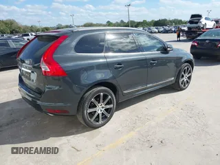 2015 Volvo XC60 T5 Drive-E Premier Plus with VIN YV440MDC7F2606774, listed as a IAAI auction lot 41564034 with 166,758 mi miles. Bid and sale history available at carsss.com. Image 4.