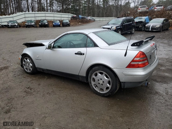 1999 Mercedes-Benz SLK-Class with VIN WDBKK47F5XF086576, listed as a Copart auction lot 81454264 with 128,339 mi miles and Salvage Title. Bid and sale history available at carsss.com. Image 2.