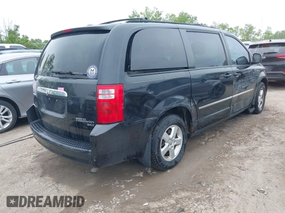 2010 Dodge Grand Caravan SXT z VIN 2D4RN5D12AR444953, wystawiony jako IAAI lot #42247277 z przebiegiem 214 387 mil mil oraz . Historia ofert i sprzedaży dostępna na DreamBid. Obrazek 4.