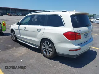 2014 Mercedes-Benz GL 450 with VIN 4JGDF7CE4EA348588, listed as a IAAI auction lot 42601136 with 129,166 mi miles and . Bid and sale history available at DreamBid. Image 3.