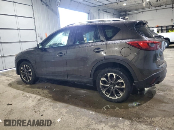 2016 Mazda CX-5 Grand Touring with VIN JM3KE4DY0G0765406, listed as a Copart auction lot 46499385 with 116,155 mi miles and Salvage Title. Bid and sale history available at carsss.com. Image 2.