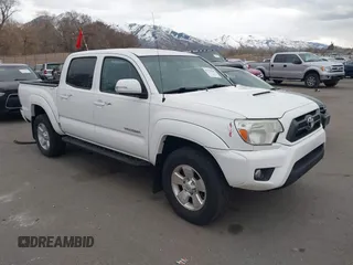 2015 Toyota Tacoma with VIN 3TMLU4EN2FM176180, listed as a IAAI auction lot 41778149 with 104,059 mi miles and . Bid and sale history available at DreamBid. Image 1.