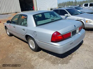 1998 Mercury Grand Marquis LS with VIN 2MEFM75W6WX669533, listed as a IAAI auction lot 41896982 with 153,155 mi miles. Bid and sale history available at carsss.com. Image 3.