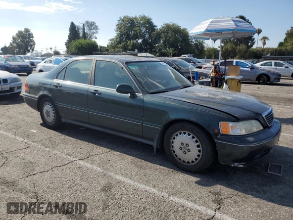 1996 Acura RL with VIN JH4KA965XTC009917, listed as a Copart auction lot 65083665 with 197,486 mi miles and Salvage title. Bid and sale history available at DreamBid. Image 4.