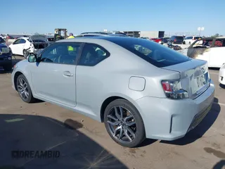 2015 Scion tC with VIN JTKJF5C7XFJ012872, listed as a IAAI auction lot 42128621 with 100,832 mi miles. Bid and sale history available at carsss.com. Image 3.