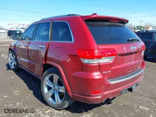 2014 Jeep Grand Cherokee Overland with VIN 1C4RJFCG2EC216406, listed as a IAAI auction lot 41944794 with 124,007 mi miles. Bid and sale history available at carsss.com. Image 3.