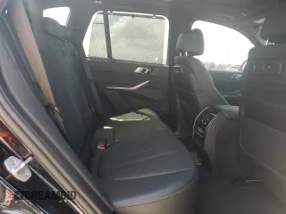 2023 BMW X5 M50i z VIN 5UXJU4C09P9P94657, wystawiony jako Copart lot #50709685 z przebiegiem Nie podano mil oraz Szkoda całkowita • Salvage title. Historia ofert i sprzedaży dostępna na DreamBid. Obrazek 11.