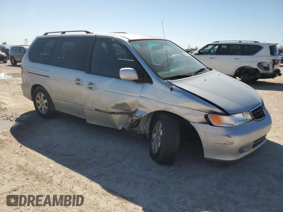2003 Honda Odyssey EX-L with VIN 5FNRL18903B145567, listed as a Copart auction lot 47925695 with 294,627 mi miles and Salvage Title. Bid and sale history available at DreamBid. Image 4.