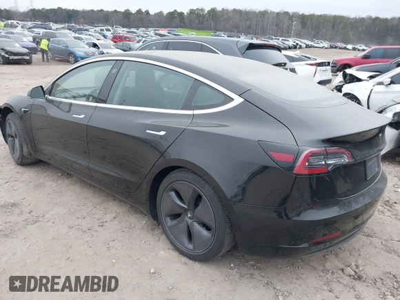 2019 Tesla Model 3 Mid Range with VIN 5YJ3E1EA5KF297213, listed as a IAAI auction lot 41361412 with 93,801 mi miles and . Bid and sale history available at carsss.com. Image 3.