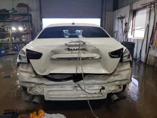 2014 Maserati Ghibli S Q4 with VIN ZAM57RTA4E1117703, listed as a Copart auction lot 48754515 with 104,284 mi miles and Salvage Title. Bid and sale history available at carsss.com. Image 6.