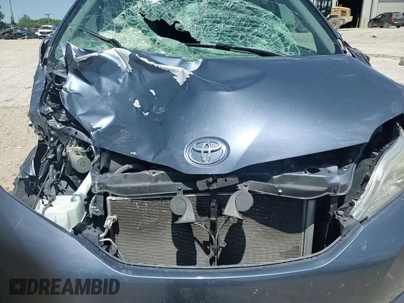 2015 Toyota Sienna LE with VIN 5TDJK3DC4FS107711, listed as a Copart auction lot 57693005 with 141,370 mi miles and Salvage title. Bid and sale history available at DreamBid. Image 14.