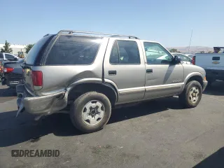 2002 Chevrolet Blazer LS с VIN 1GNDT13W02K126453, выставлен на аукционе Copart как лот 62340355 с пробегом 287 687 миль миль и Списание • Salvage title. История ставок и продаж доступна на DreamBid. Изображение 3.