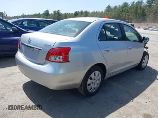 2009 Toyota Yaris with VIN JTDBT903X91300439, listed as a IAAI auction lot 42105998 with 195,880 mi miles. Bid and sale history available at carsss.com. Image 4.