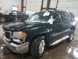 2004 GMC Yukon SLT with VIN 1GKEK13ZX4R198169, listed as a IAAI auction lot 41577015 with 169,562 mi miles. Bid and sale history available at carsss.com. Image 17.