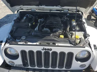 2015 Jeep Wrangler Unlimited Sahara with VIN 1C4BJWEG3FL584920, listed as a Copart auction lot 61843525 with 62,876 mi miles and Salvage title. Bid and sale history available at DreamBid. Image 12.