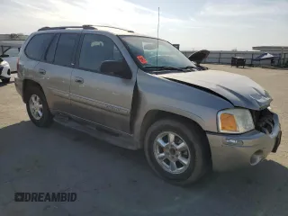 2003 GMC Envoy SLE with VIN 1GKDS13S332390989, listed as a Copart auction lot 74729104 with 127,680 mi miles and Salvage Title. Bid and sale history available at carsss.com. Image 4.