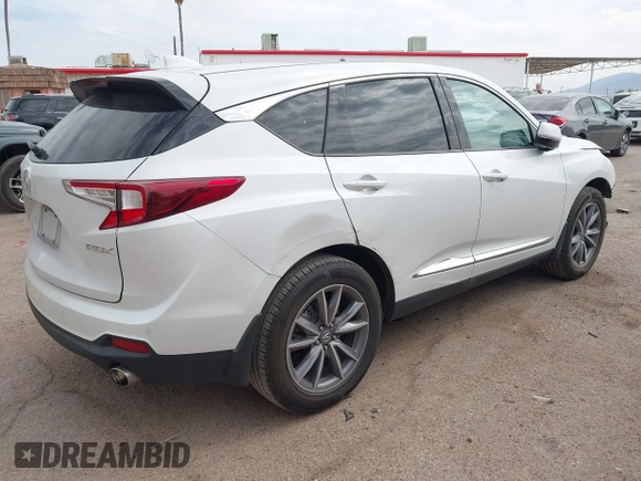 2021 Acura RDX w/Technology Package with VIN 5J8TC1H51ML022573, listed as a IAAI auction lot 41893265 with 56,516 mi miles. Bid and sale history available at carsss.com. Image 4.