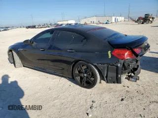 2015 BMW M6 z VIN WBS6C9C5XFD467952, wystawiony jako Copart lot #46312895 z przebiegiem 79 807 mil mil oraz Szkoda całkowita • Salvage title. Historia ofert i sprzedaży dostępna na DreamBid. Obrazek 2.