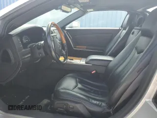 2004 Cadillac XLR z VIN 1G6YV34A945601007, wystawiony jako Copart lot #77077394 z przebiegiem Nie podano mil oraz Szkody całkowita. Historia ofert i sprzedaży dostępna na DreamBid. Obrazek 7.